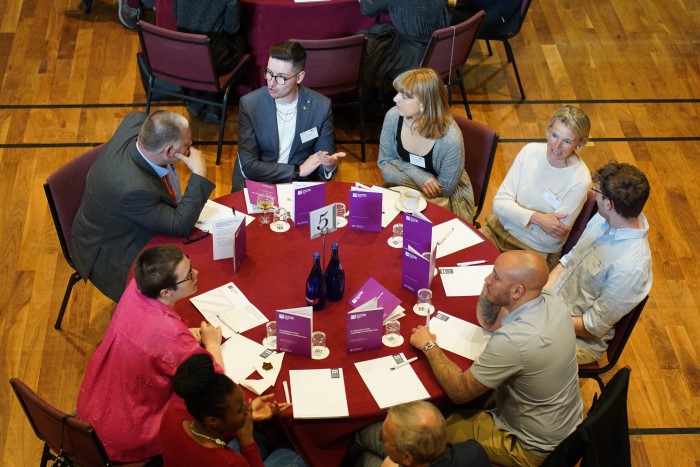 Guests discussing their experiences.