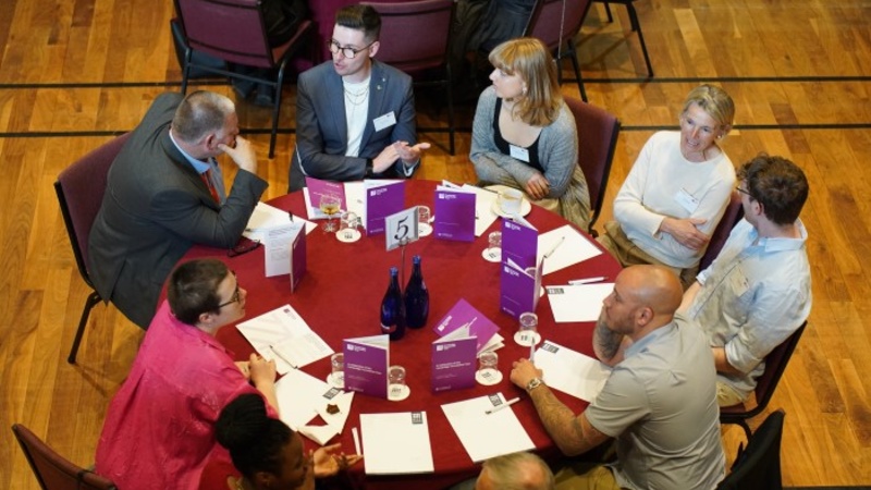 Guests discussing their experiences.