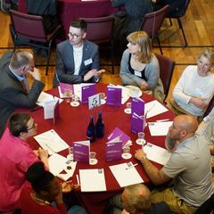 Guests discussing their experiences.